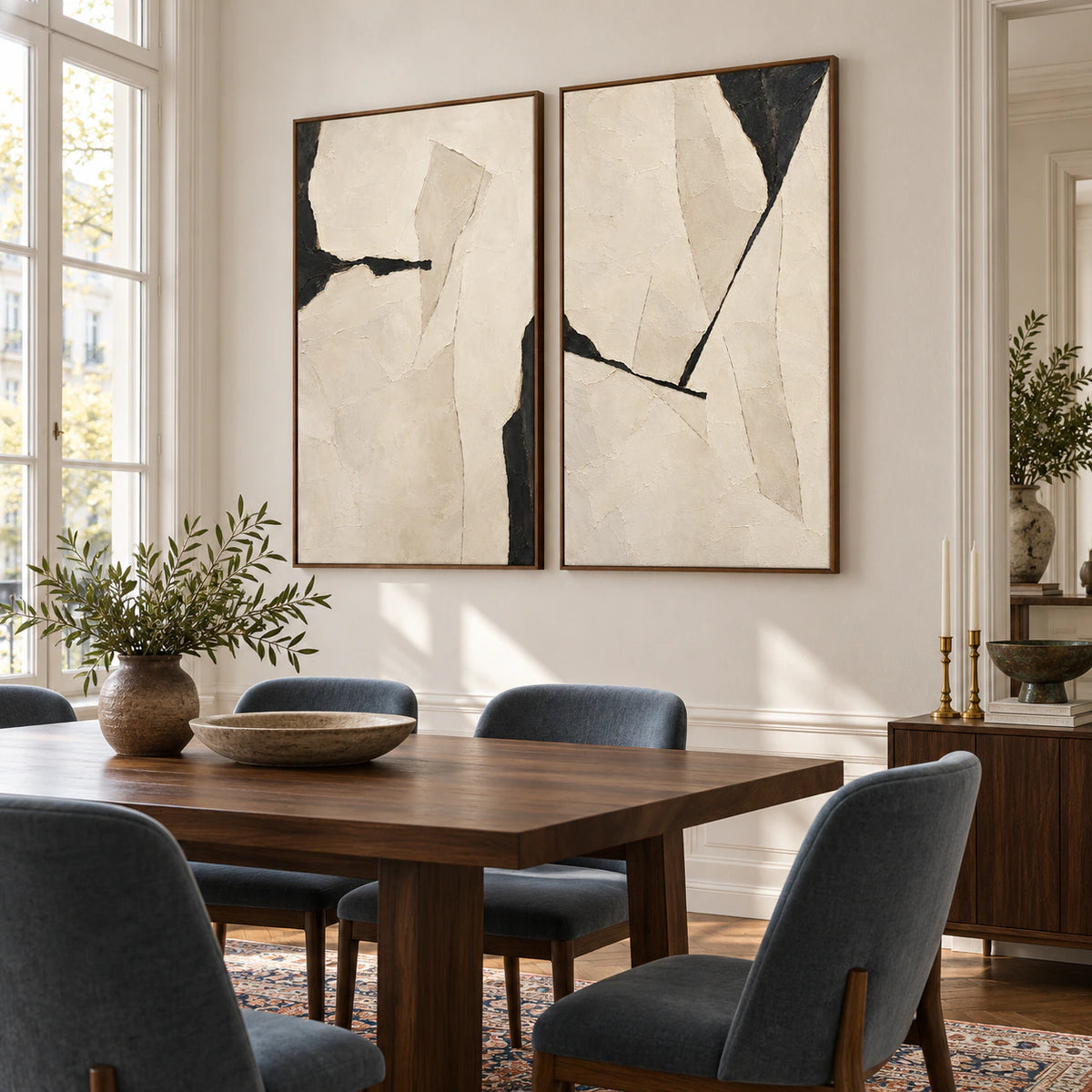 Refined dining room with the Onyx-Rupture ivory and charcoal diptych in walnut frames.