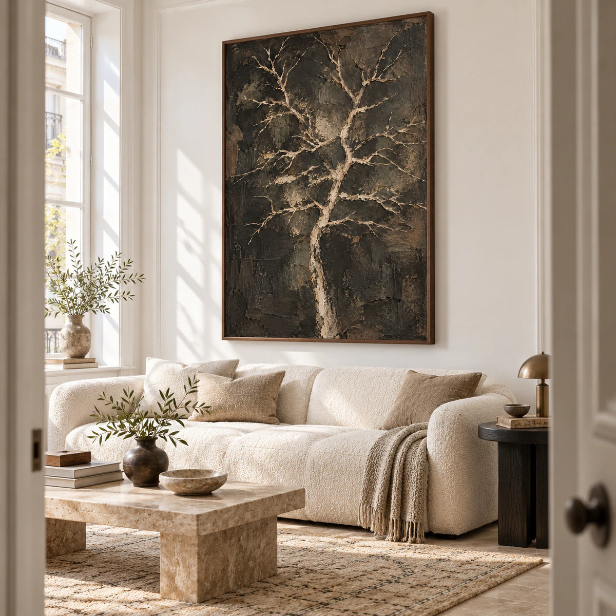Pale-Branches above a restrained sofa in a bright contemporary living room.