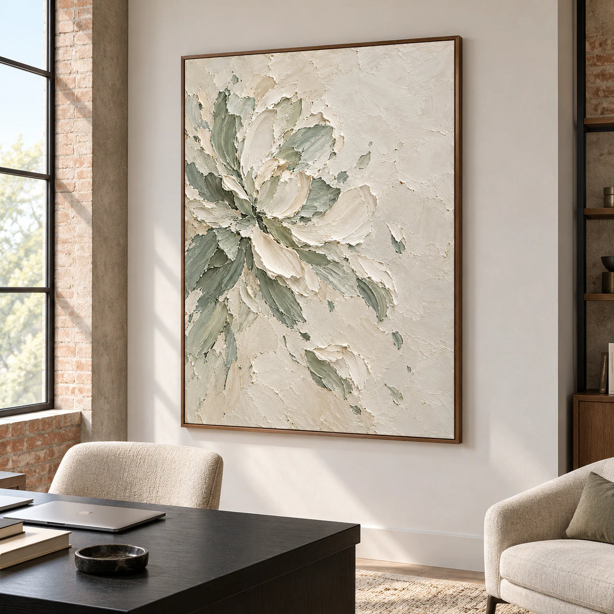 Large textured floral painting in an airy home office beside a simple desk and reading chair, lit by clear natural daylight.
