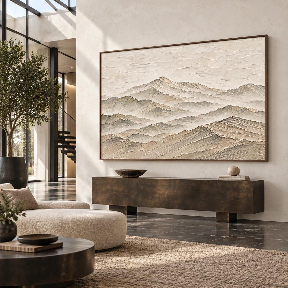 Large mountain artwork in a gallery-scale sunlit foyer.