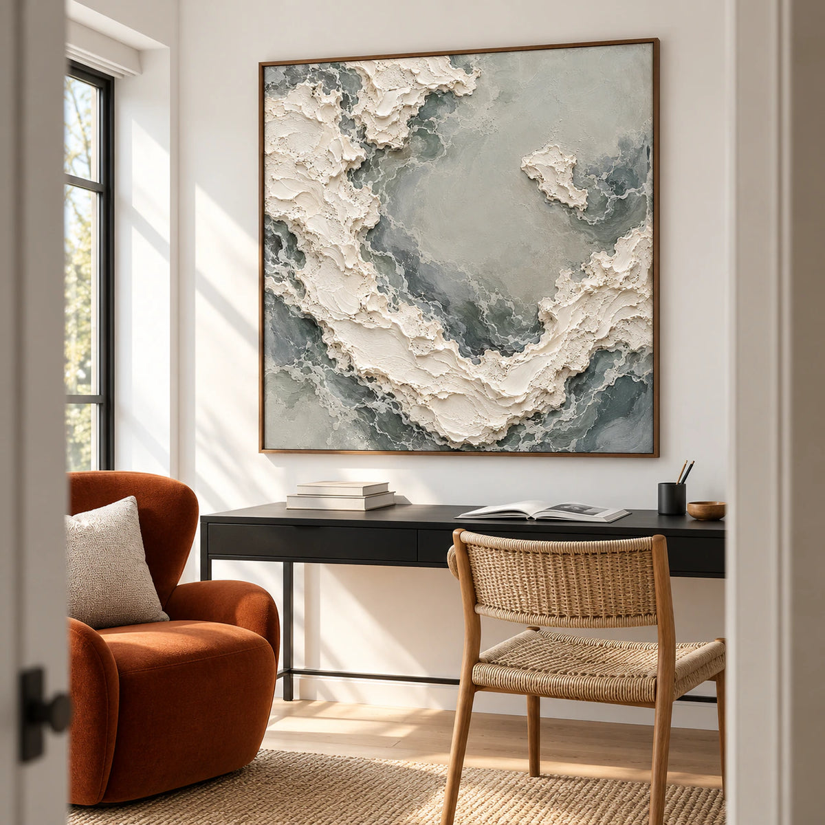 Pale-Torrent above a simple black desk beside a sculptural reading chair in a bright home office, viewed from the right just above desk height.