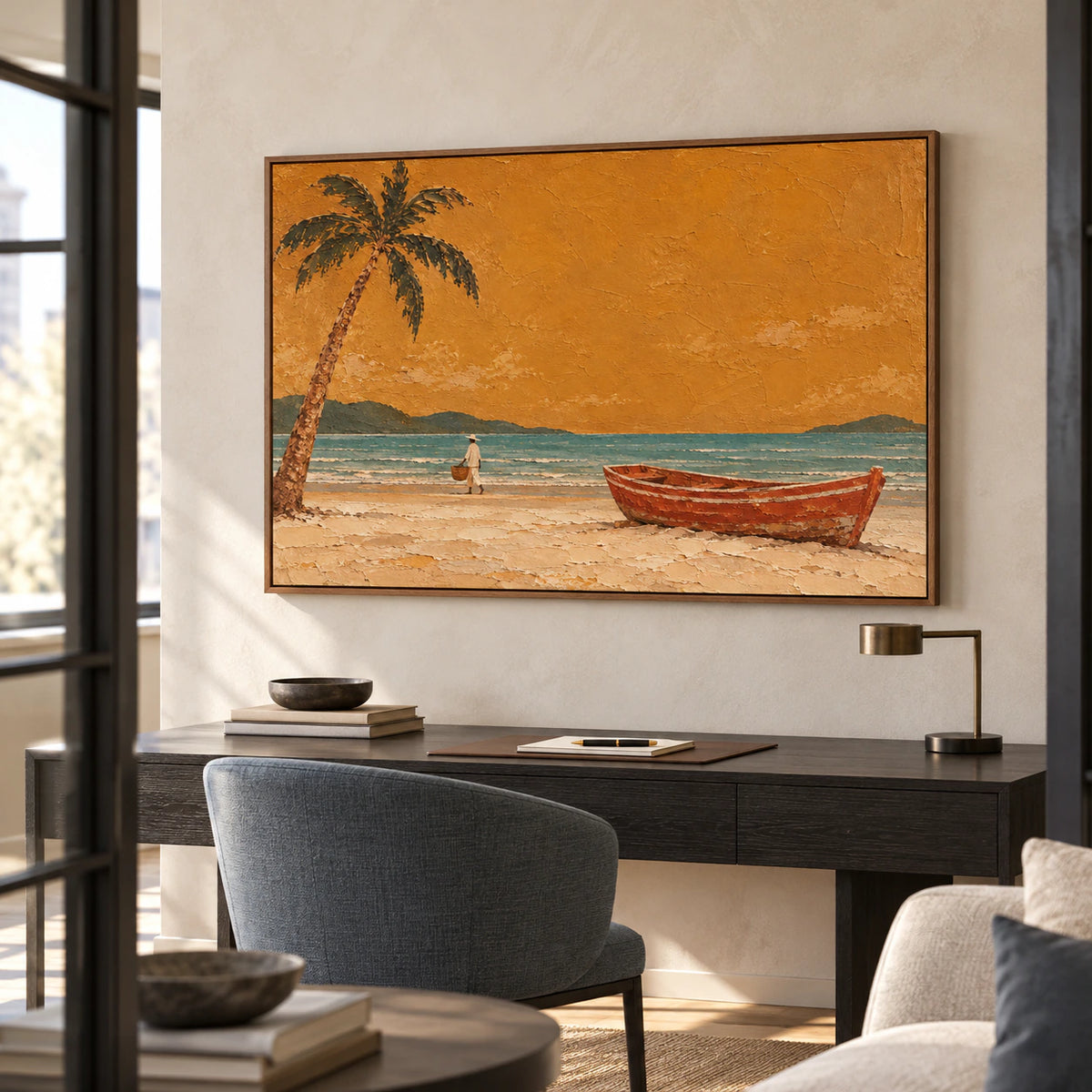 Coastal painting above a streamlined desk in a bright home office with pale walls, blackened wood and a blue-gray chair, viewed from an elevated right angle.