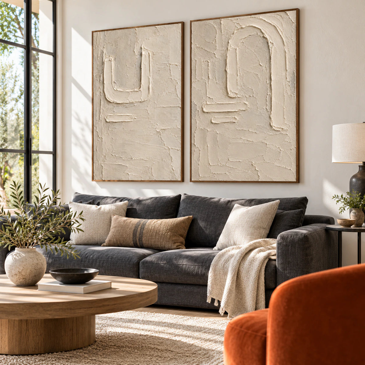 Parchment-Arcade diptych above a sofa in a bright contemporary living room.