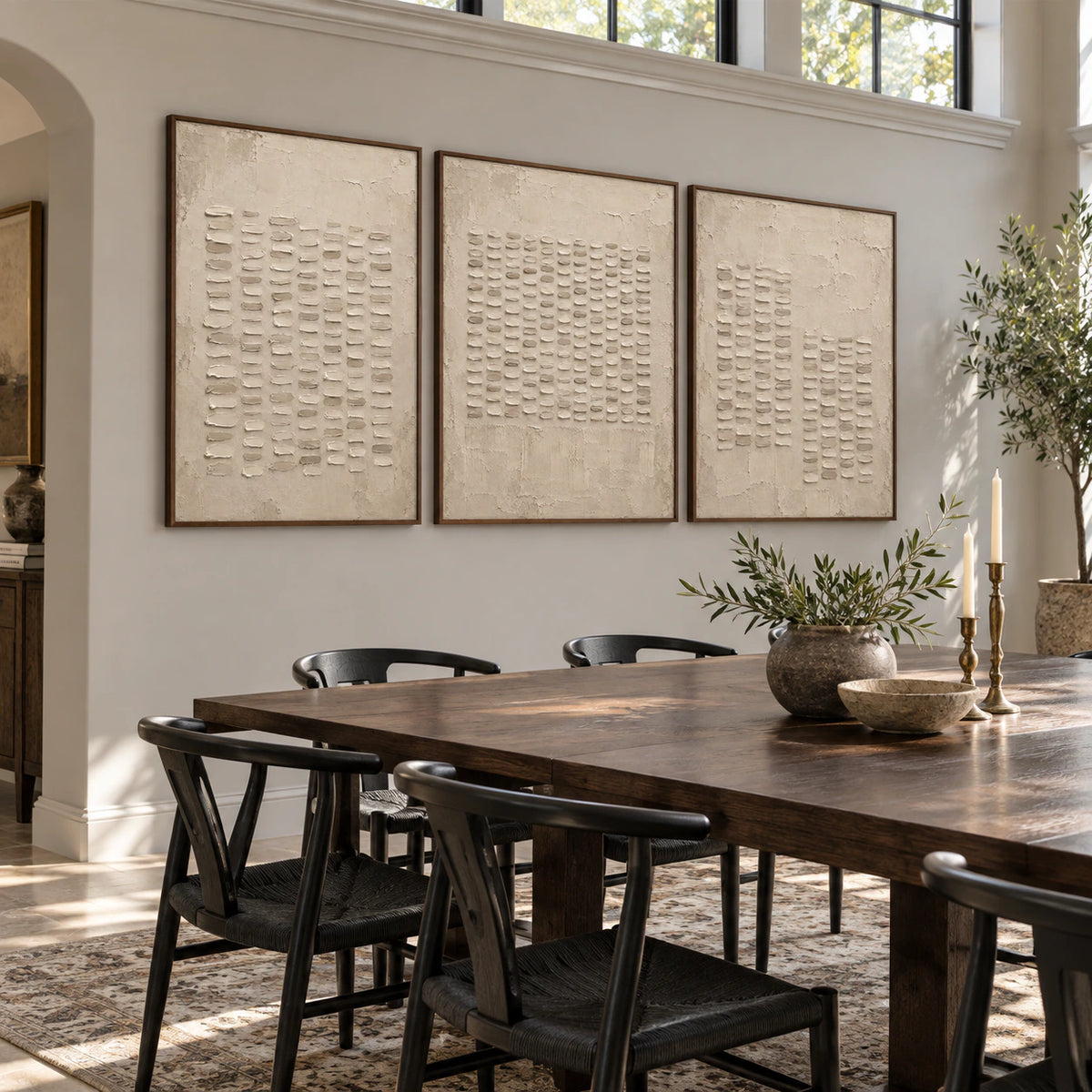Refined dining room with the Parchment-Ciphers triptych in matching slim walnut frames.
