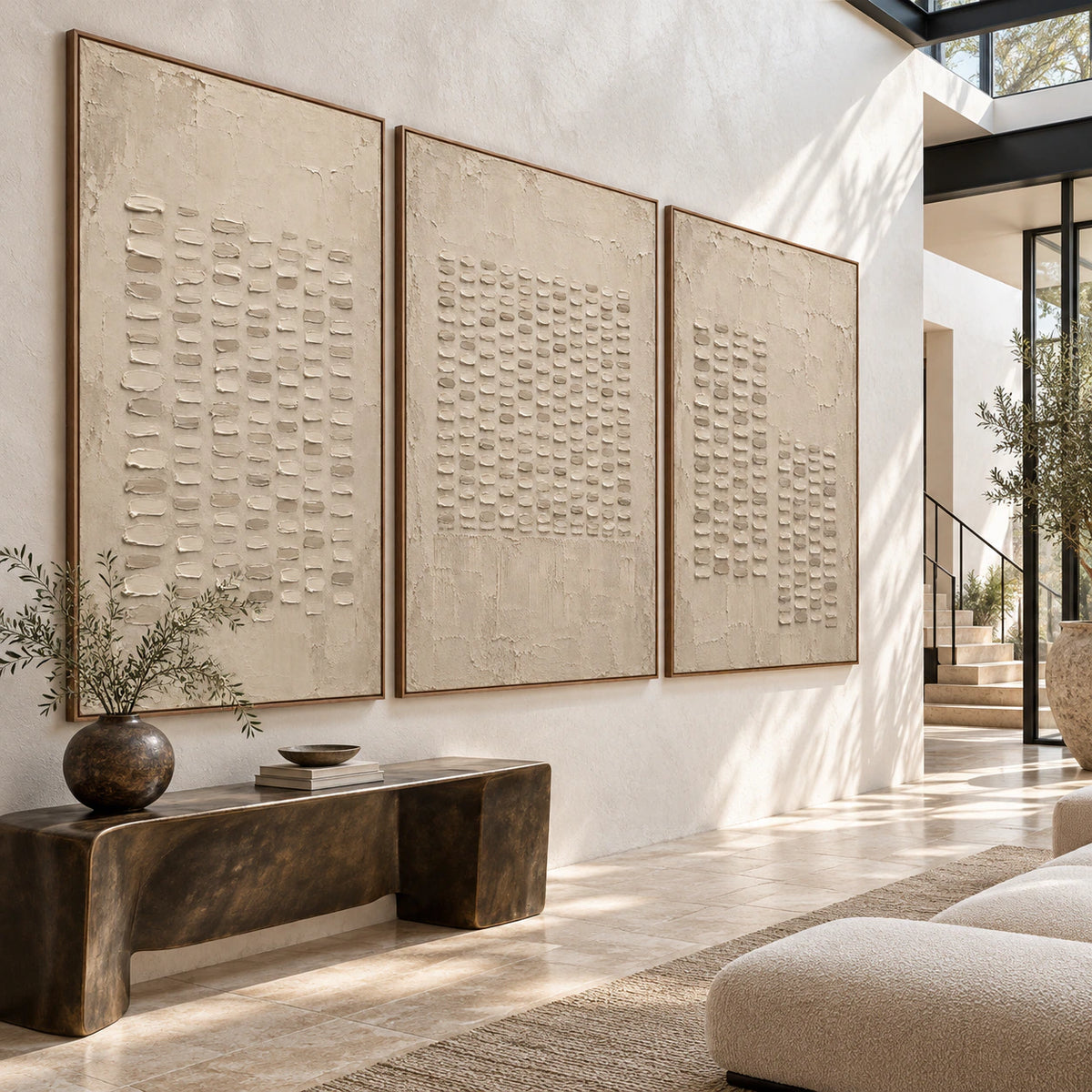 Gallery-scale foyer with the Parchment-Ciphers three-canvas set on a pale plaster wall.