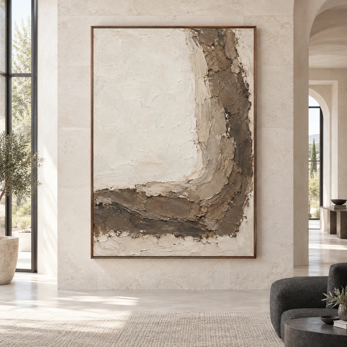 Large vertical ivory and earth-toned textured abstract painting shown straight-on in a spacious architectural room.