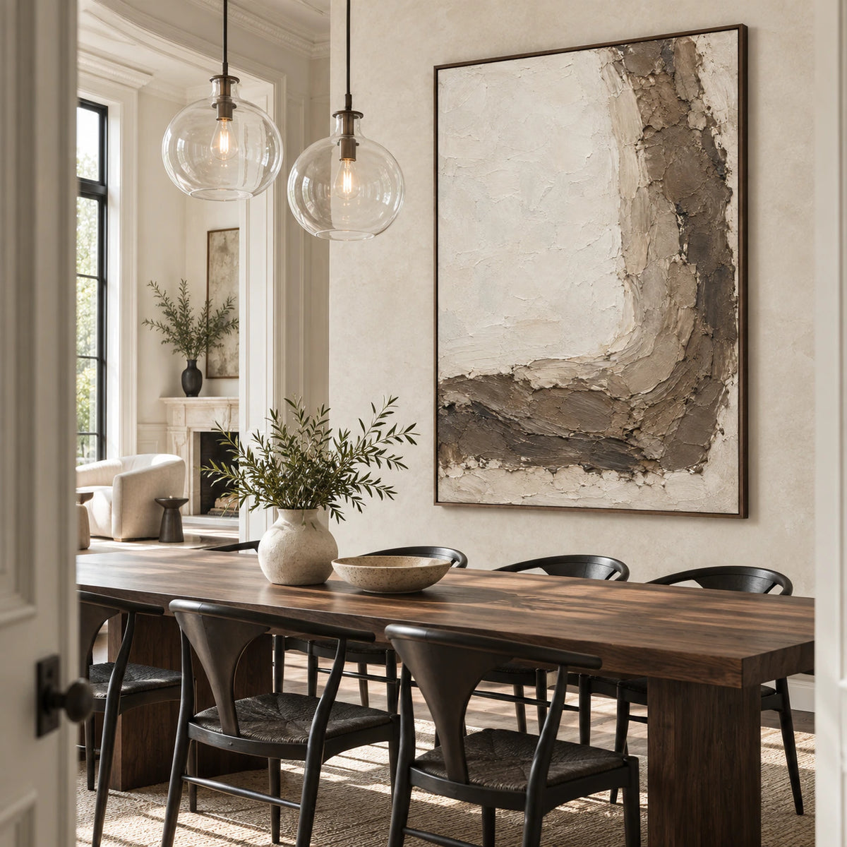 Vertical ivory and earth-toned textured abstract painting above a refined dining setting.