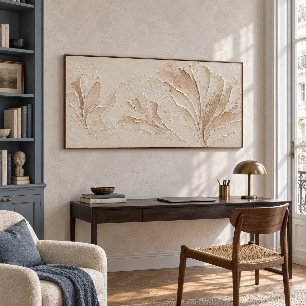 Parchment Fronds displayed above a slim desk in an airy home office with daylight, dark shelving and a simple reading chair.