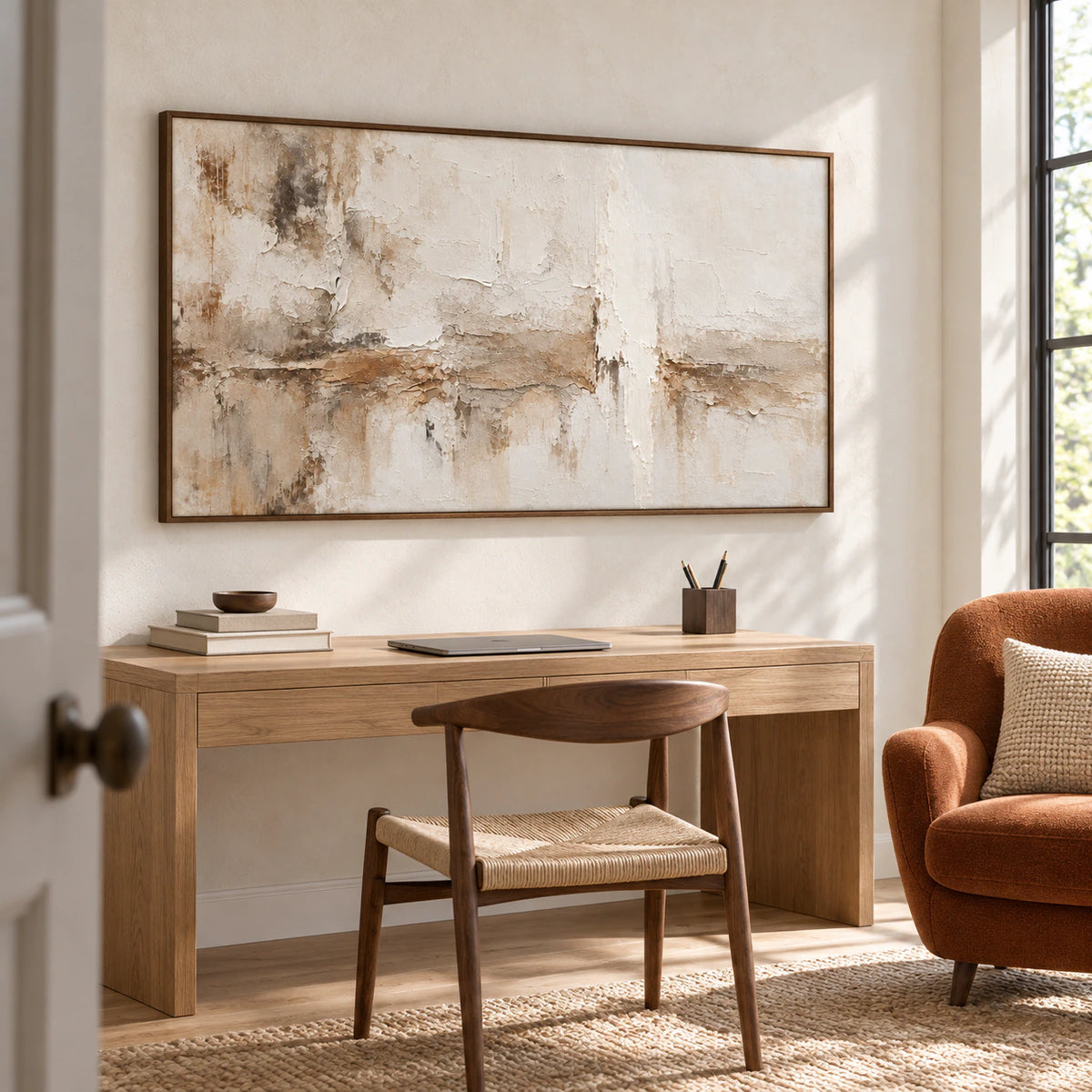 Parchment-Weather painting prominent on a bright home office wall above a simple desk and reading chair.