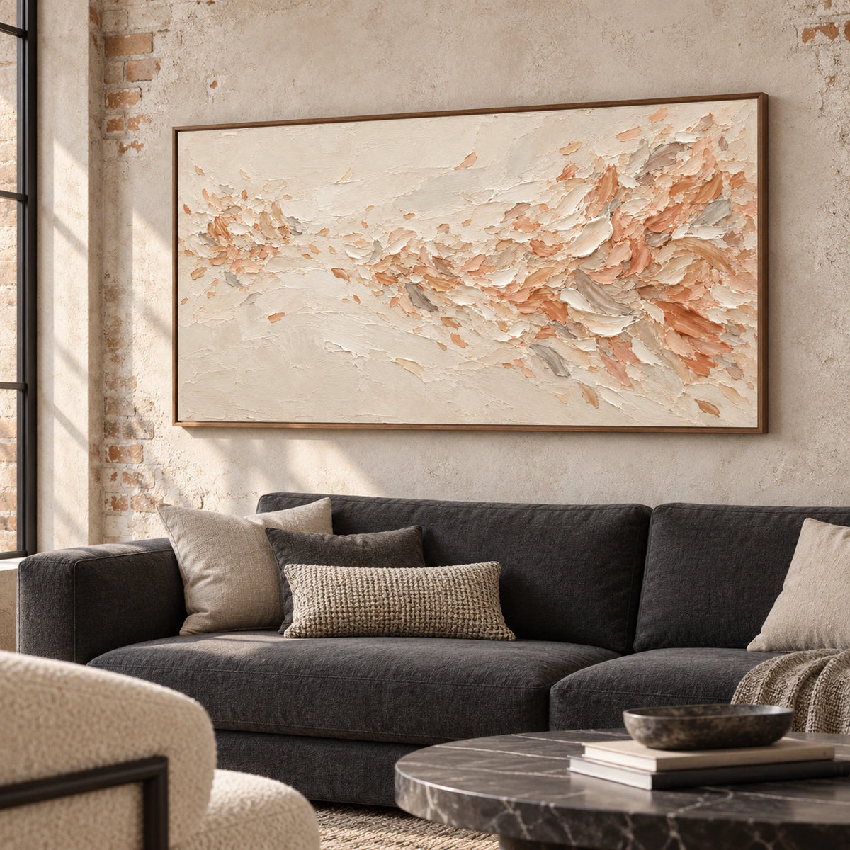 Peach-Veil above a charcoal sofa in a bright living room with pale stone walls and natural daylight.