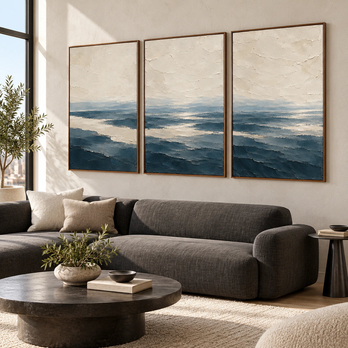 Pelagic-Strata triptych above a sofa in a bright contemporary living room.