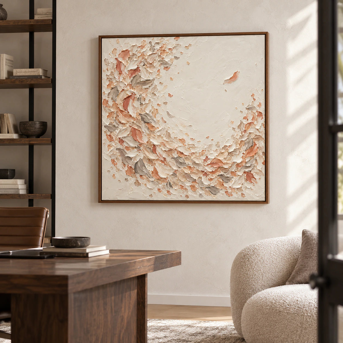 Square painting prominent on a light plaster wall in an airy home office with a dark desk, open shelving, and clear natural light.