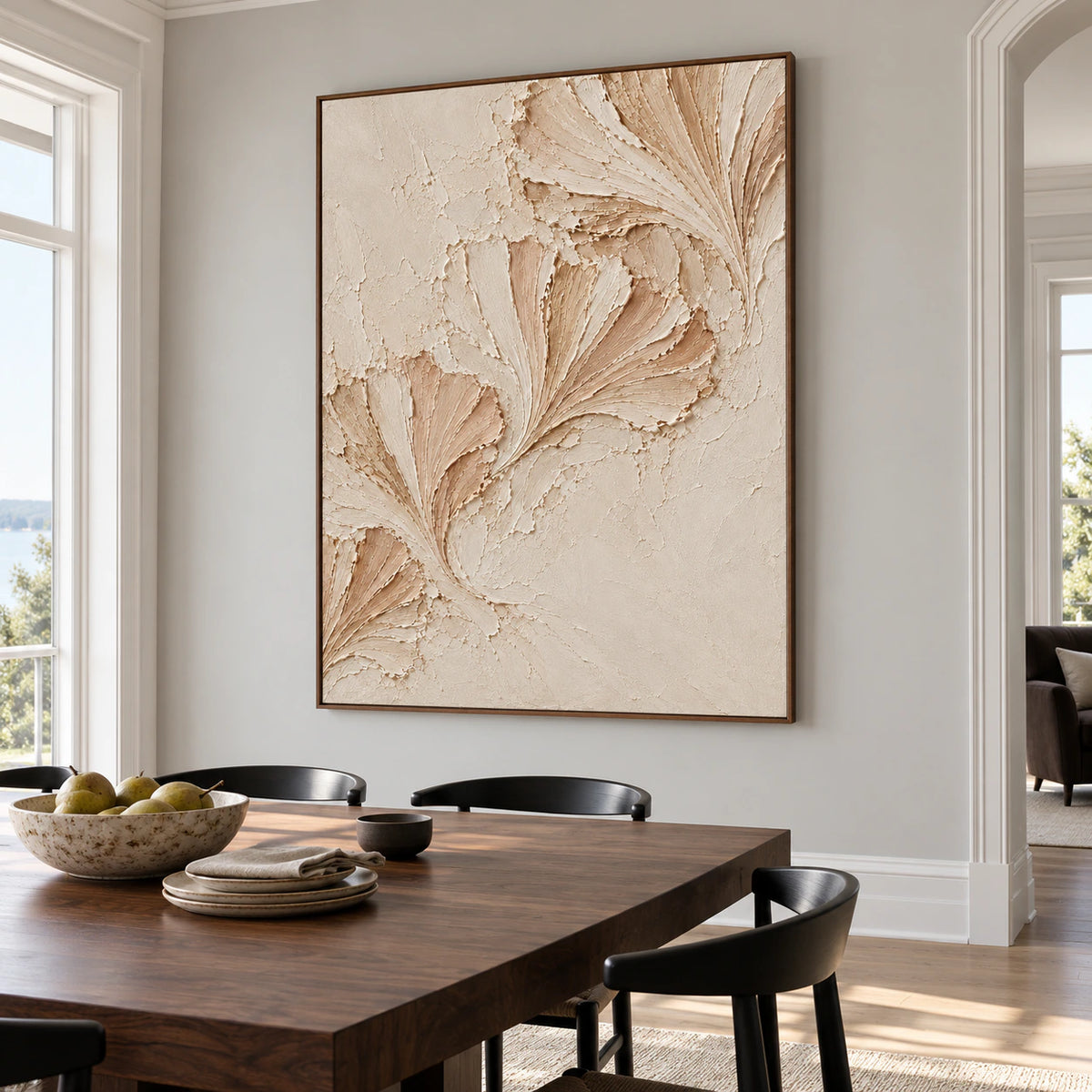 Petal-Folds on a cool pale gray wall above a dark walnut dining table with black chairs and spare tableware, viewed from the right.