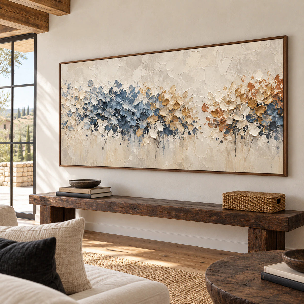 Petal-Passage above a long dark wood bench on a warm-white wall in an open, sunlit lounge with black and natural-fiber furnishings, viewed obliquely from the left.