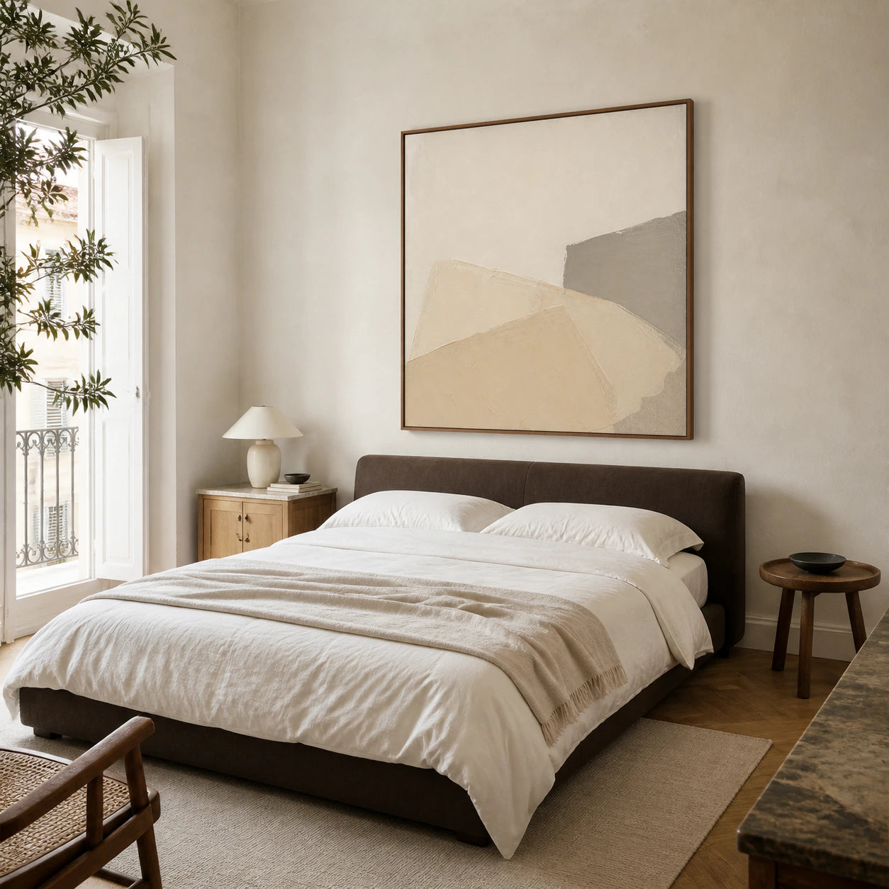 Plaster-Contour above a low bed in a quiet warm-neutral bedroom.