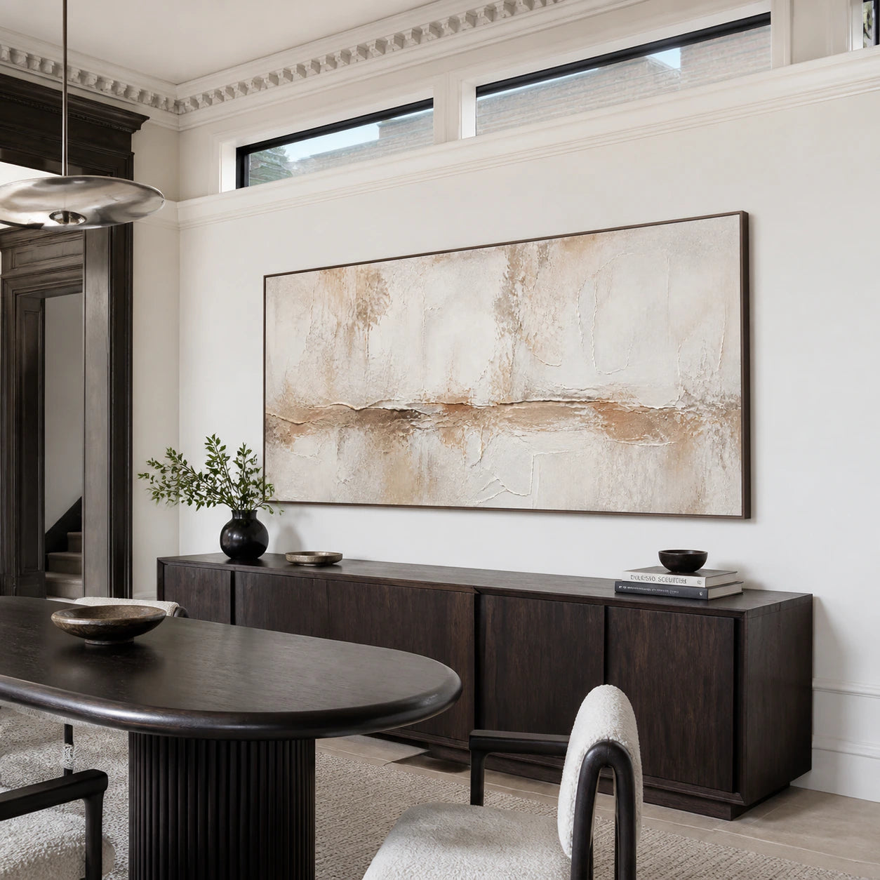 Plaster-Drift displayed prominently above a refined dining setting in natural daylight.