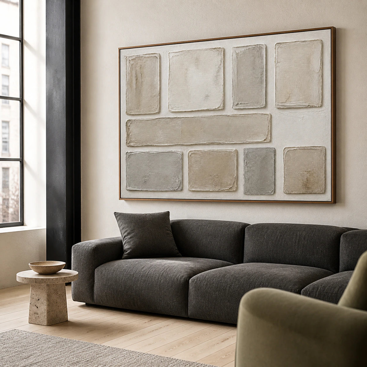 Plaster-Grid above a restrained sofa in a bright contemporary living room.