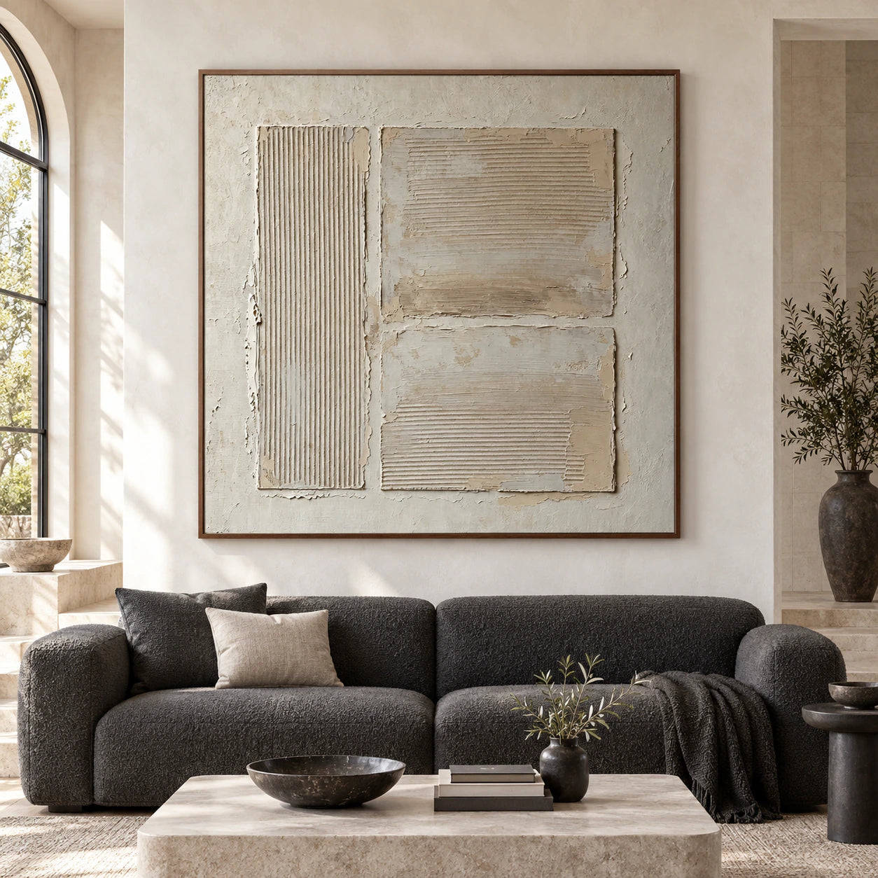 Large square ivory relief artwork displayed straight-on in an open architectural living space.