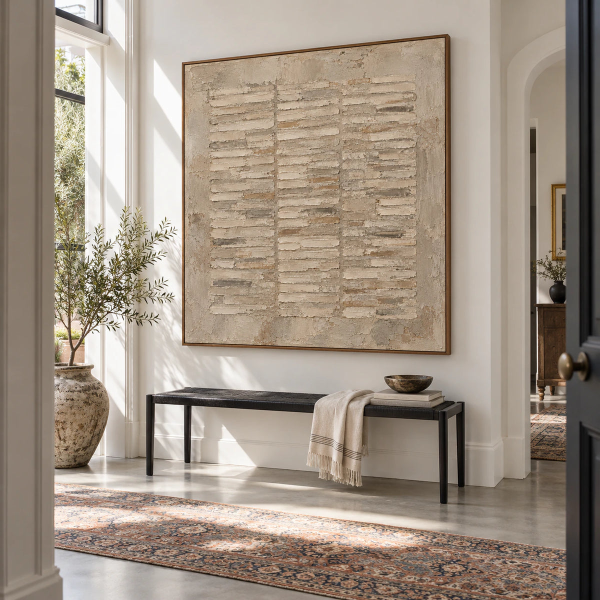 Large square textured abstract painting in a gallery-scale foyer.
