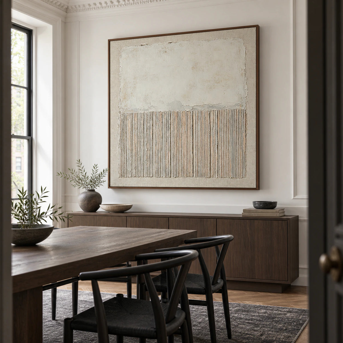 Square ivory textured abstract painting in a refined daylight dining room.