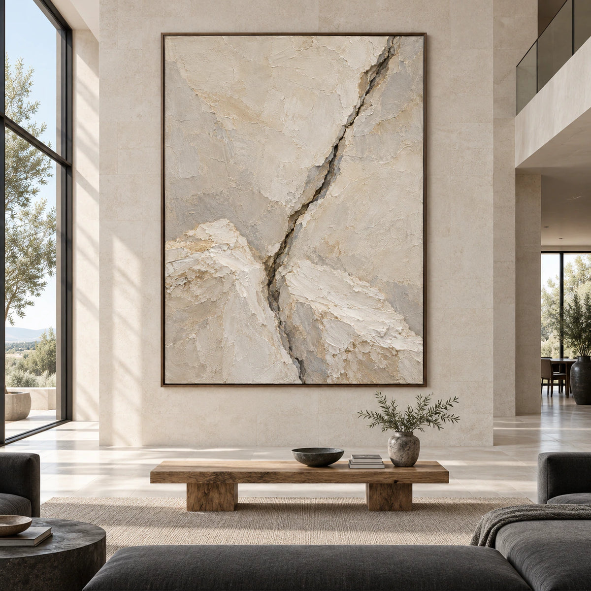 Large vertical textured abstract painting with an ivory and grey fissure composition in a spacious gallery-like living room.