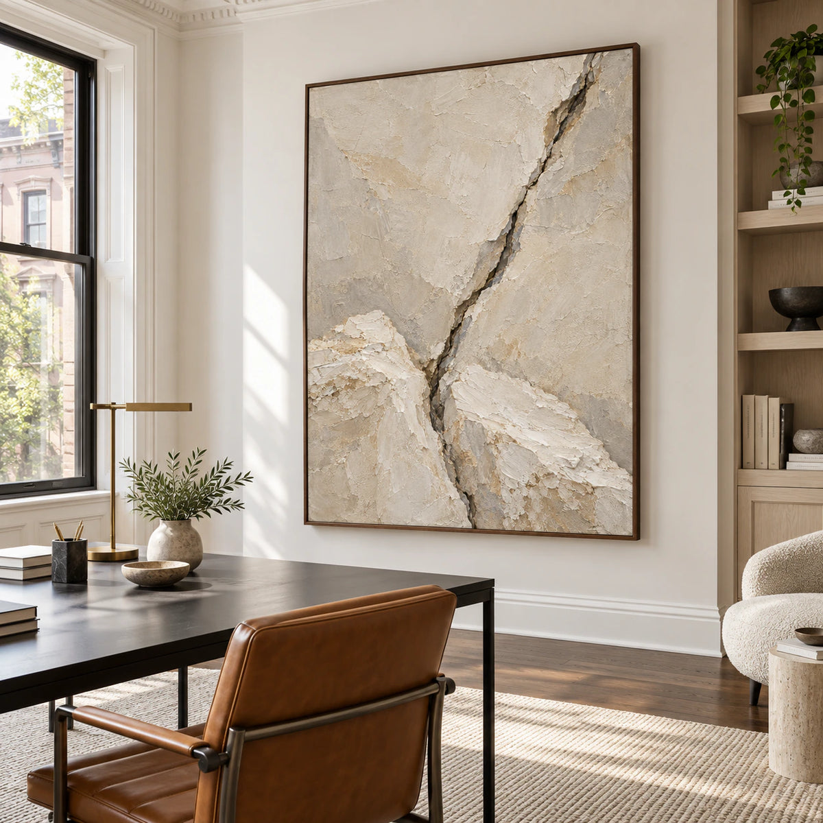 Vertical plaster-texture painting in an airy home office reading space.
