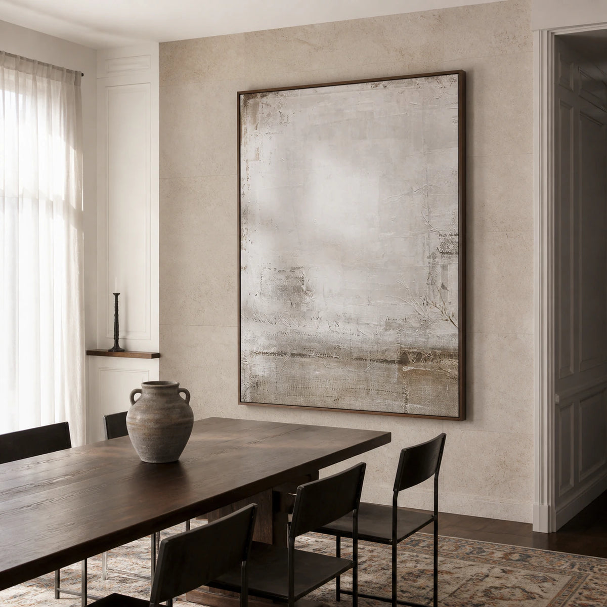 Pale textured abstract painting in a refined sunlit dining room.