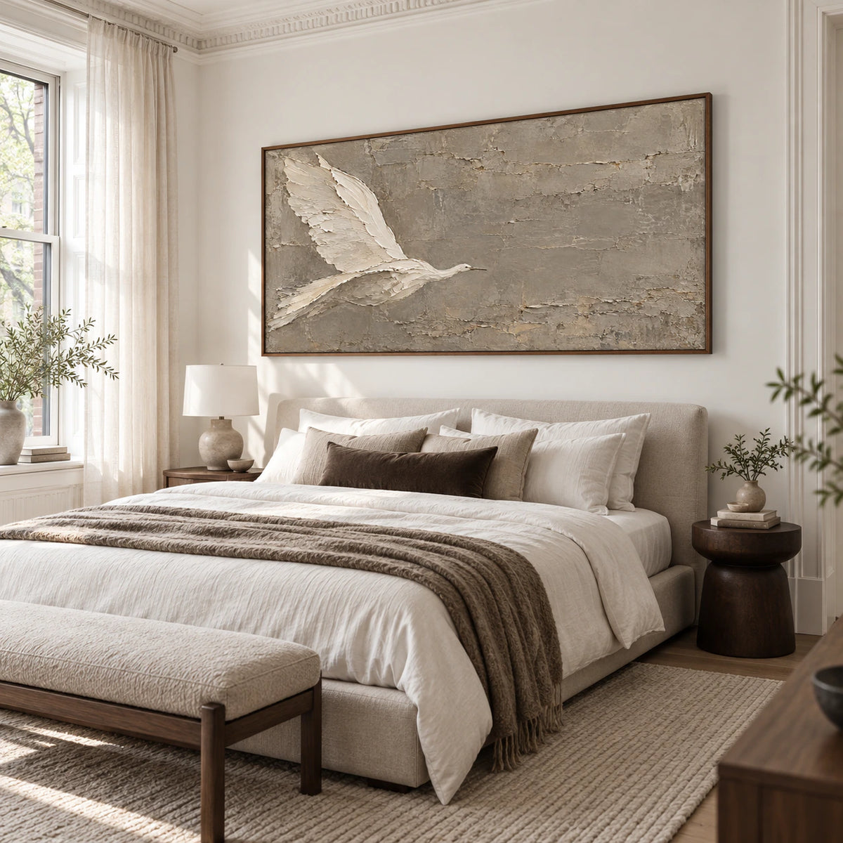 Tactile taupe bird artwork in a quiet, softly lit bedroom