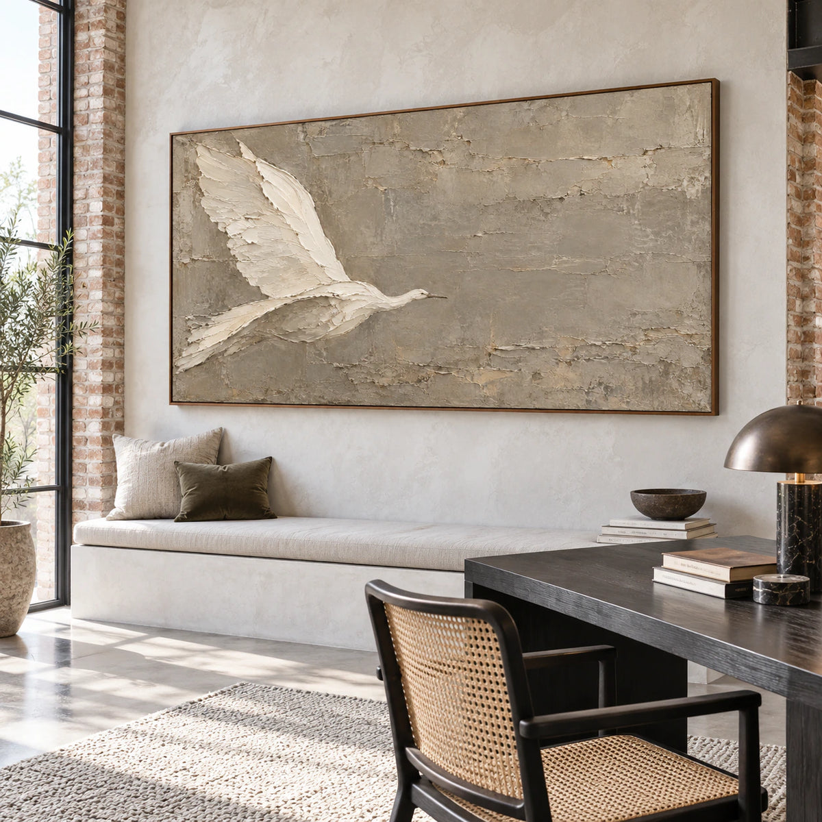 Raised bird artwork in an airy home office reading space
