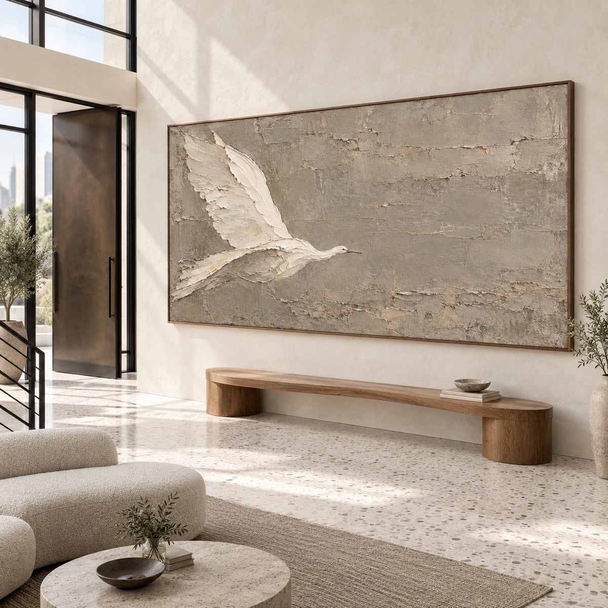 Gallery-scale textured bird artwork in a bright sculptural foyer