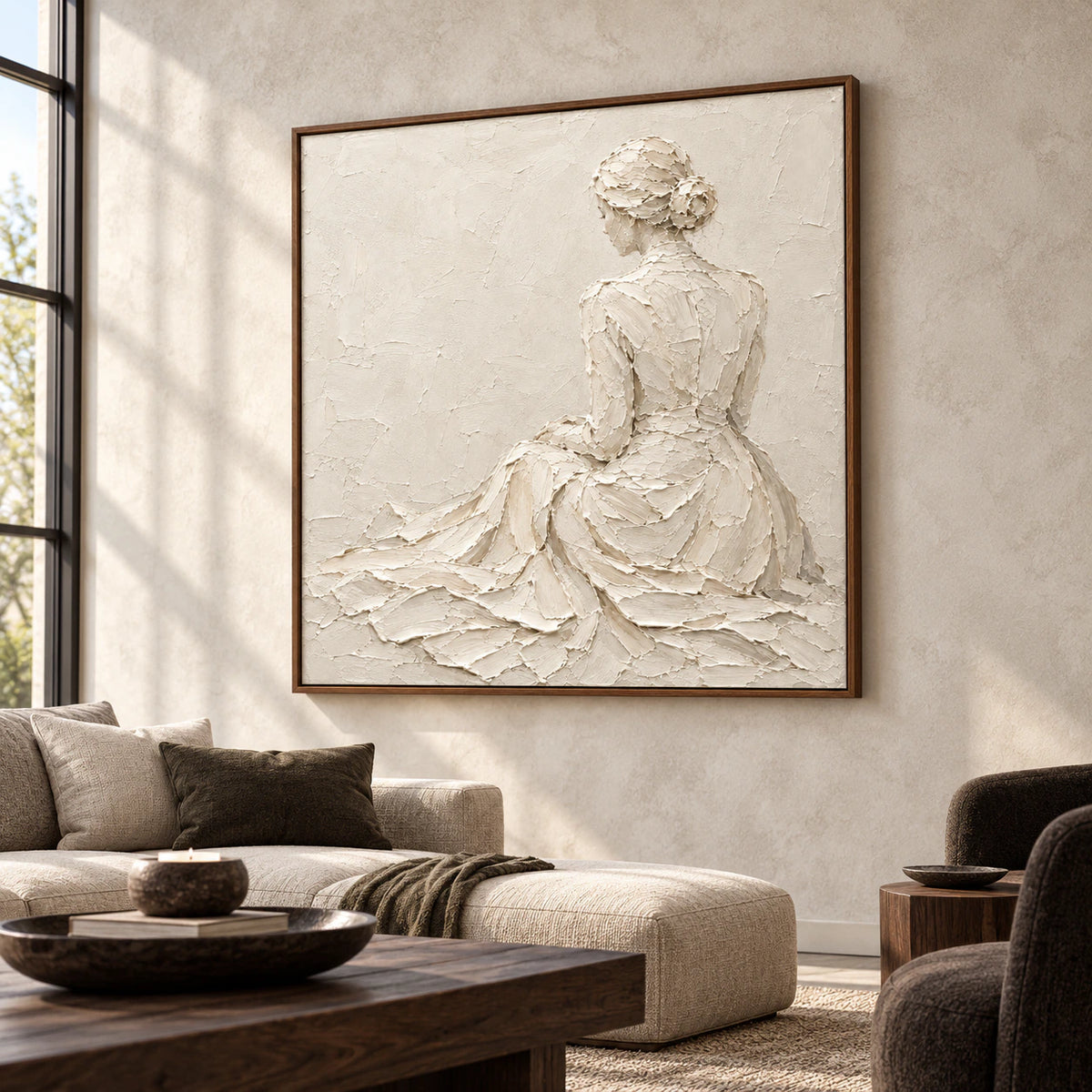 Square sculptural ivory figure artwork displayed prominently in an expansive loft interior with concrete walls, dark furnishings, and broad daylight.