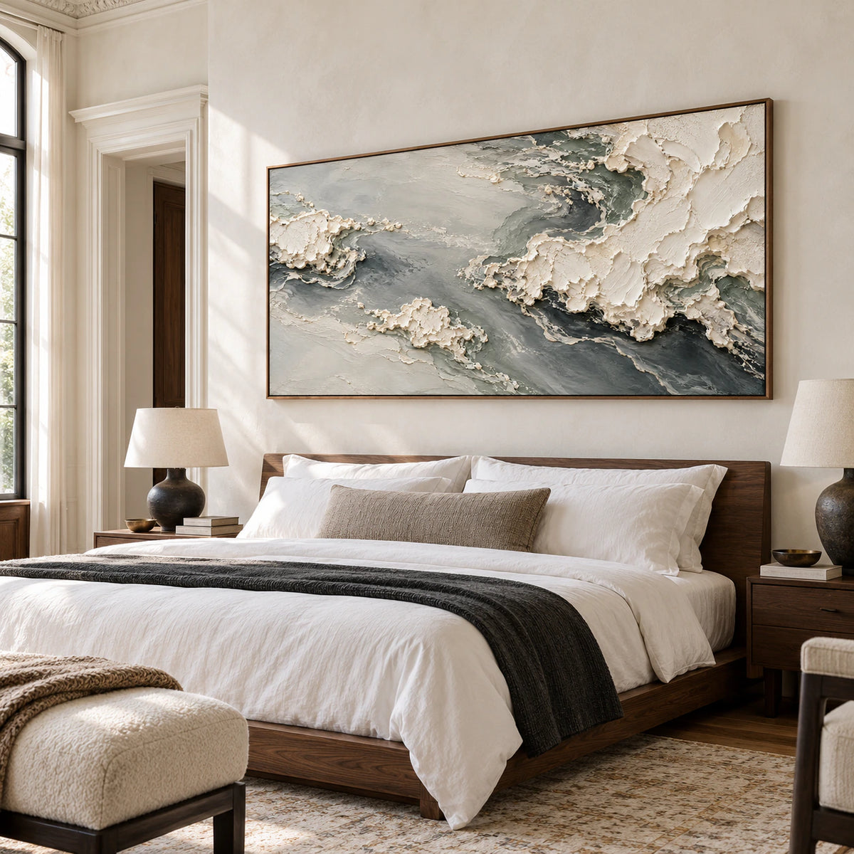Pumice-Tide in a bright bedroom with a low walnut bed, white linen and pale neutral walls, seen from a slightly elevated left oblique angle.