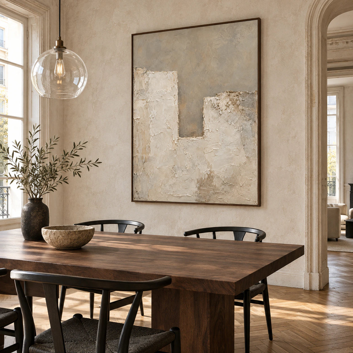 Large textured abstract artwork in a refined daylight dining room.