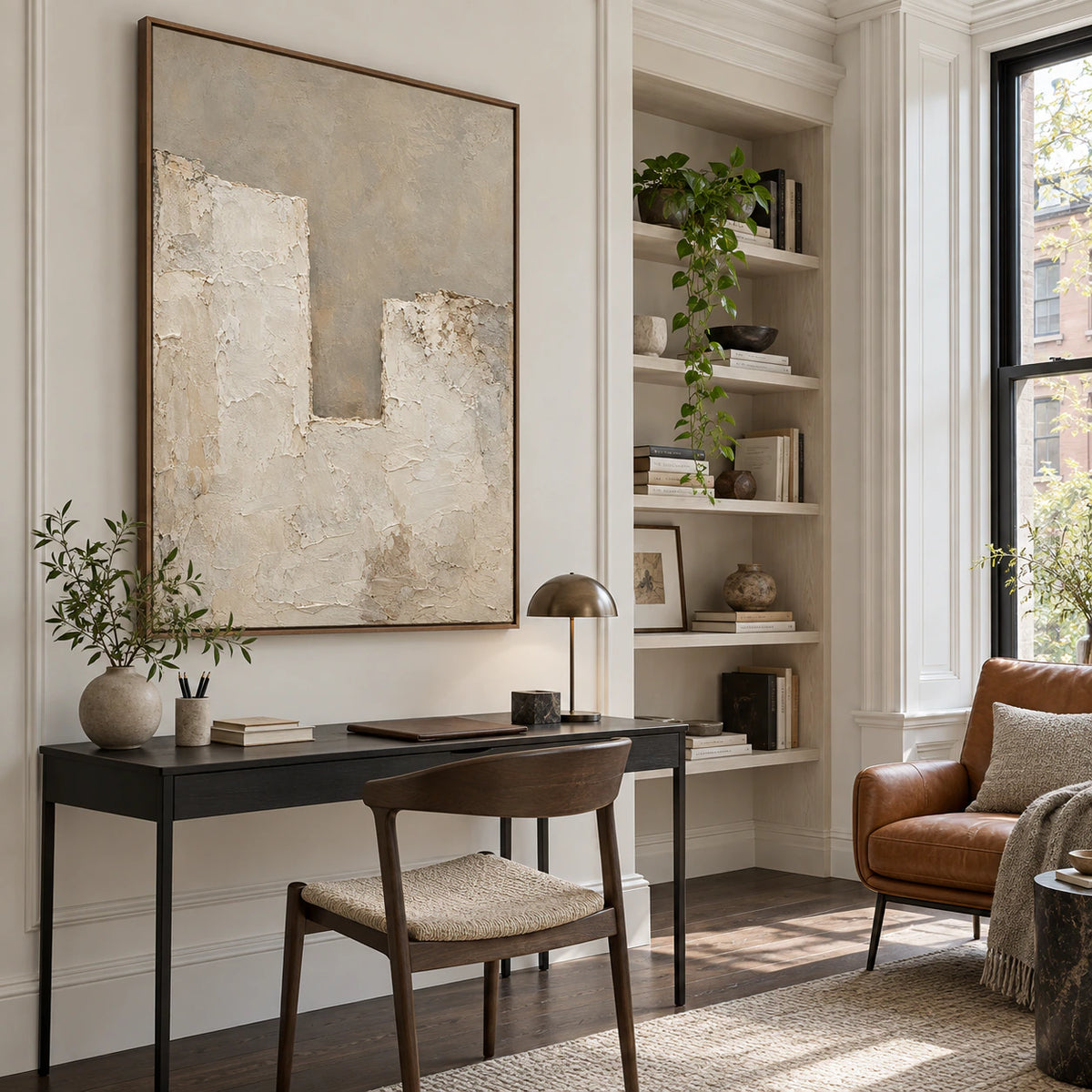 Pale architectural abstract artwork in an airy reading and home office space.
