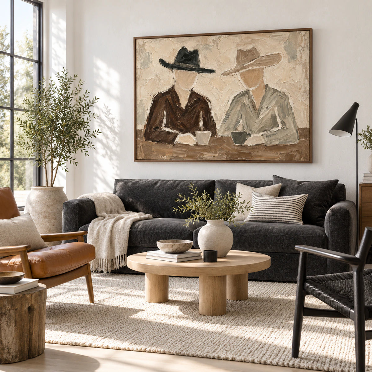 Quiet-Brims above a sculptural sofa in a bright, open living room.