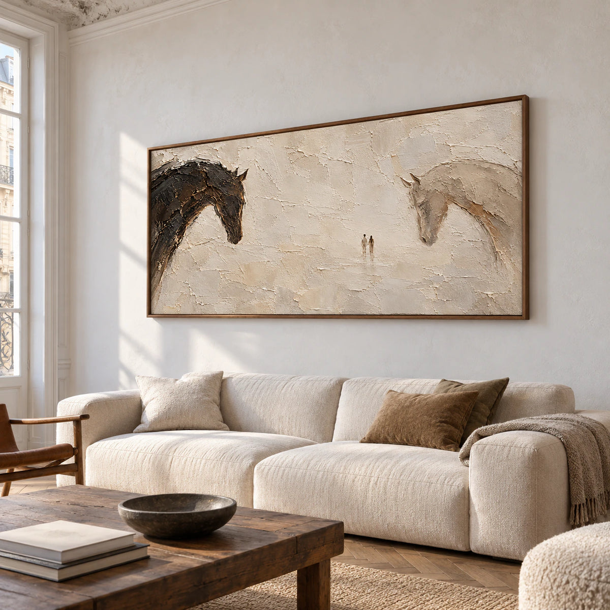Wide horse painting on a broad cool-white wall in a spacious, sunlit interior with sparse dark furniture, viewed from a low left angle.