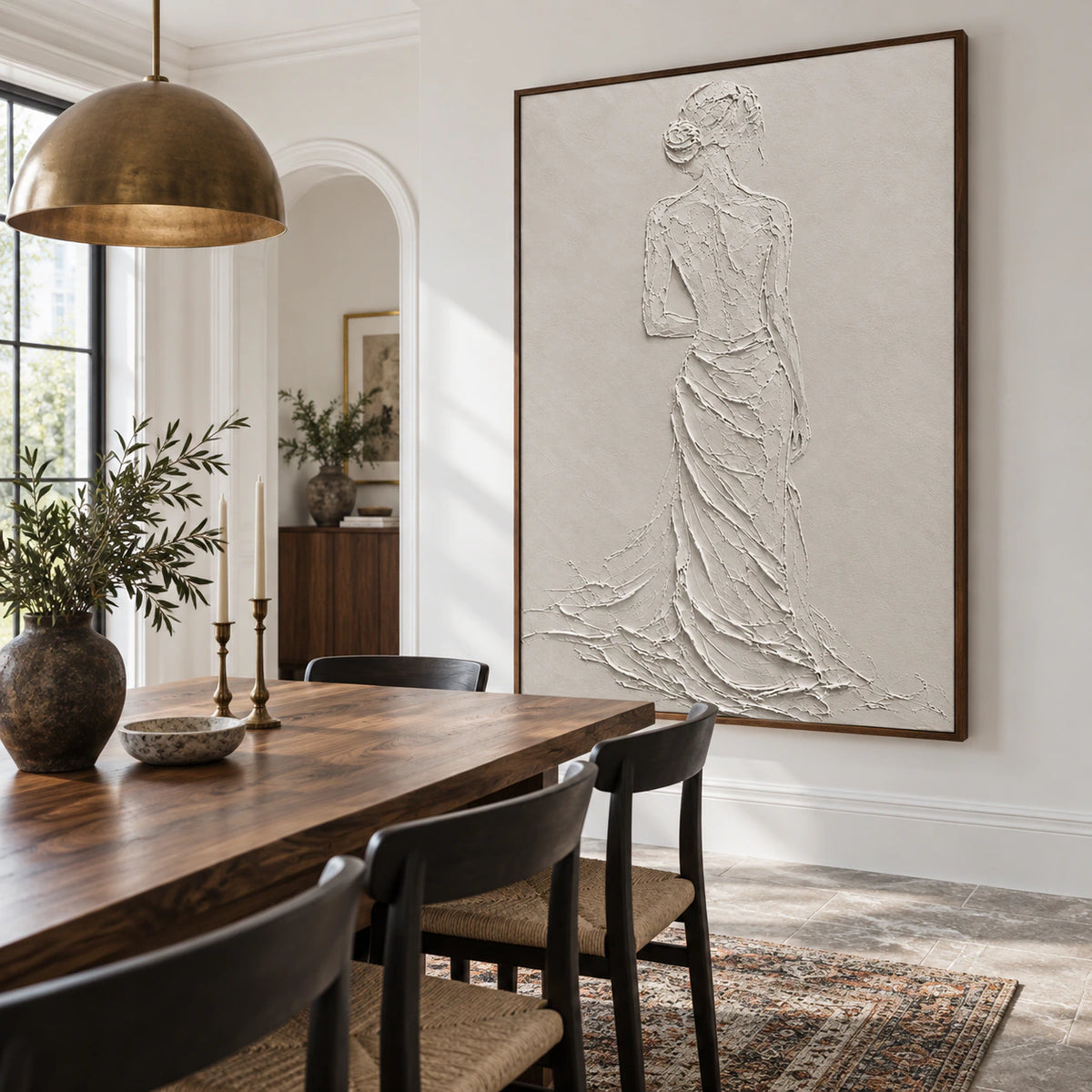 Large ivory relief figure artwork in a refined daylight dining room.