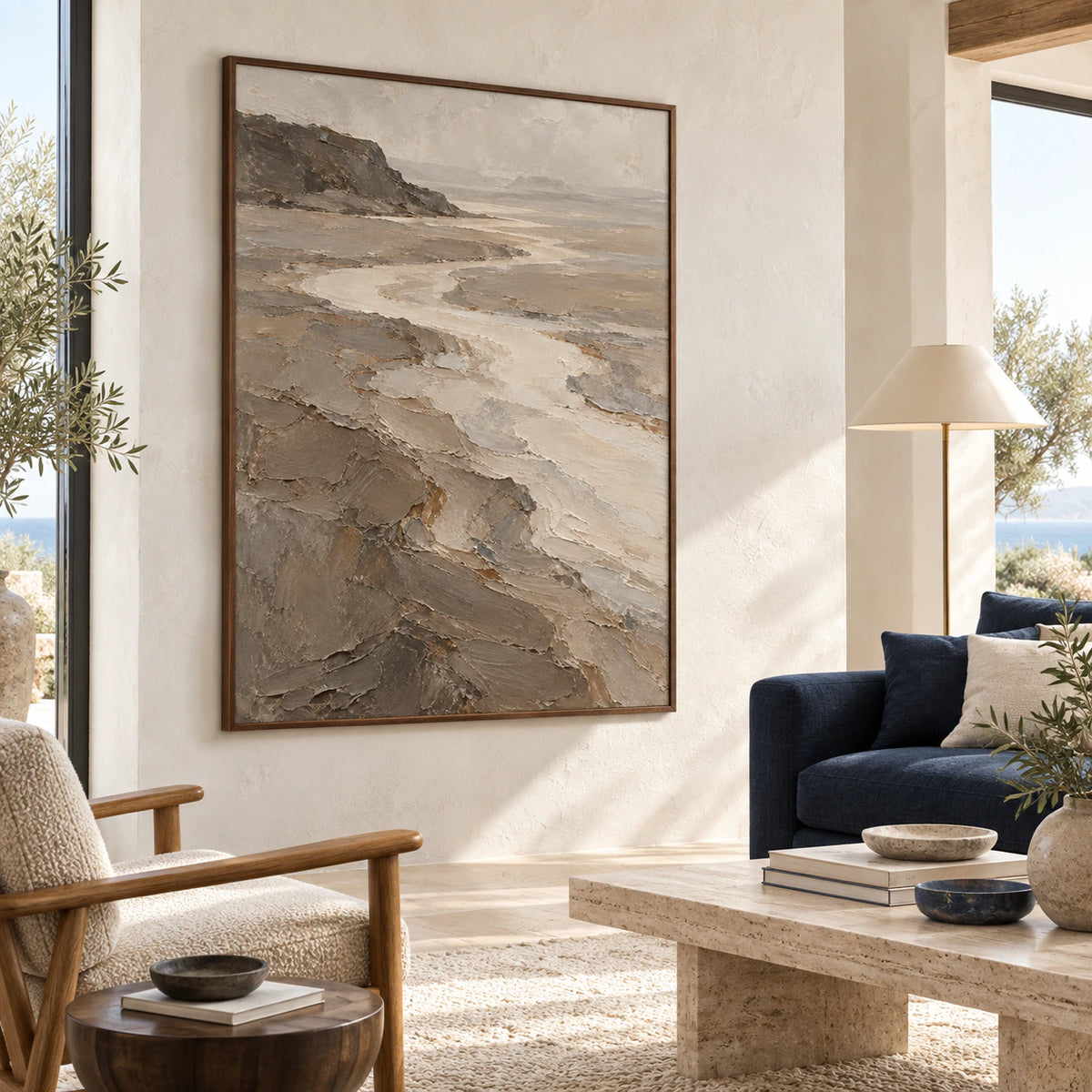 Vertical textured estuary landscape artwork above a sofa in a bright contemporary living room.