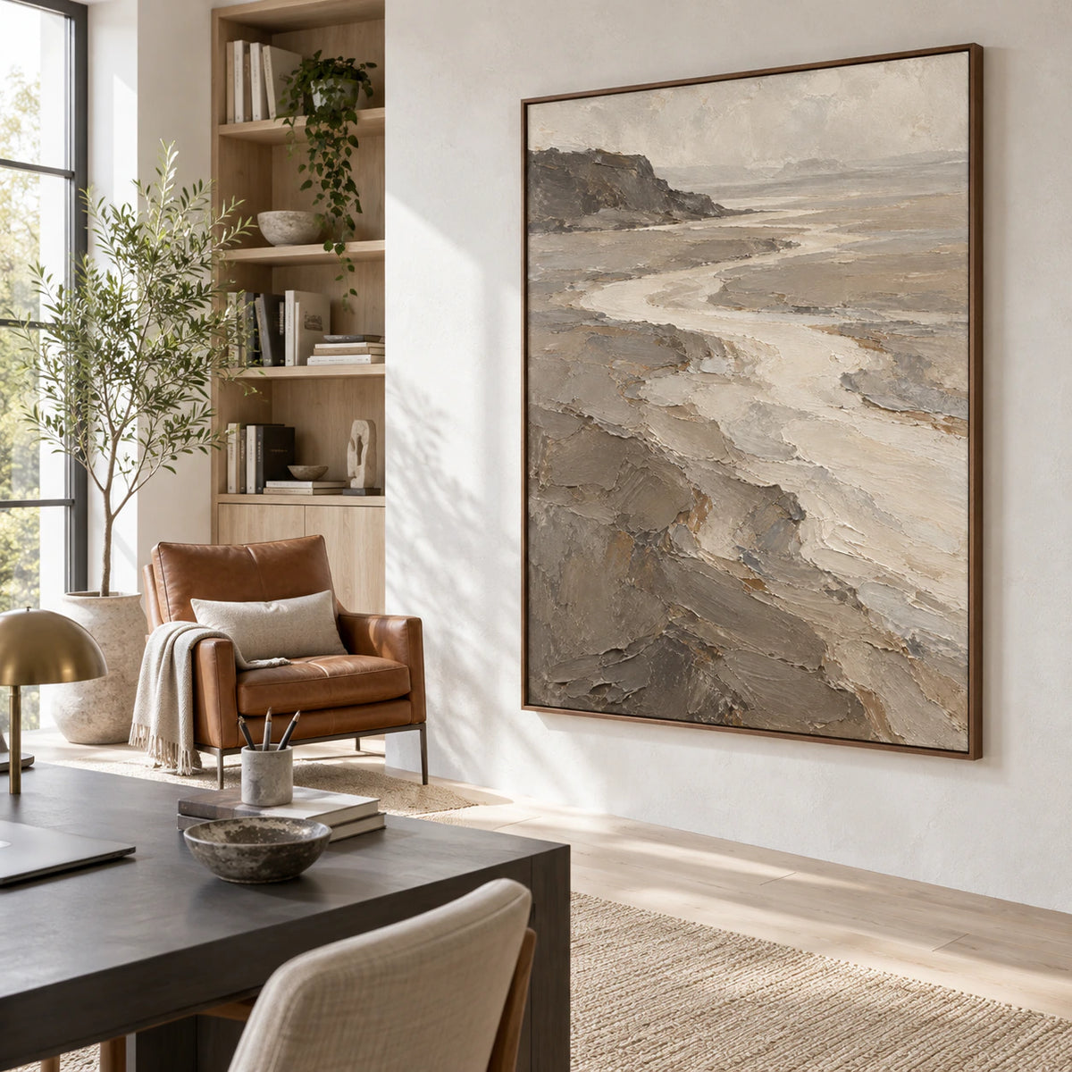 Vertical textured estuary landscape artwork in an airy home office reading space.