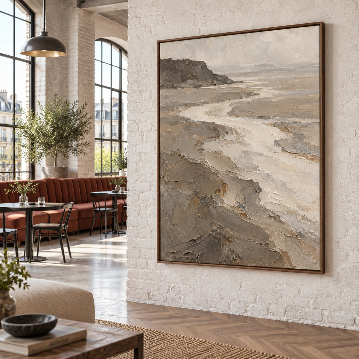 Vertical textured estuary landscape artwork in an expansive sunlit loft hospitality interior.