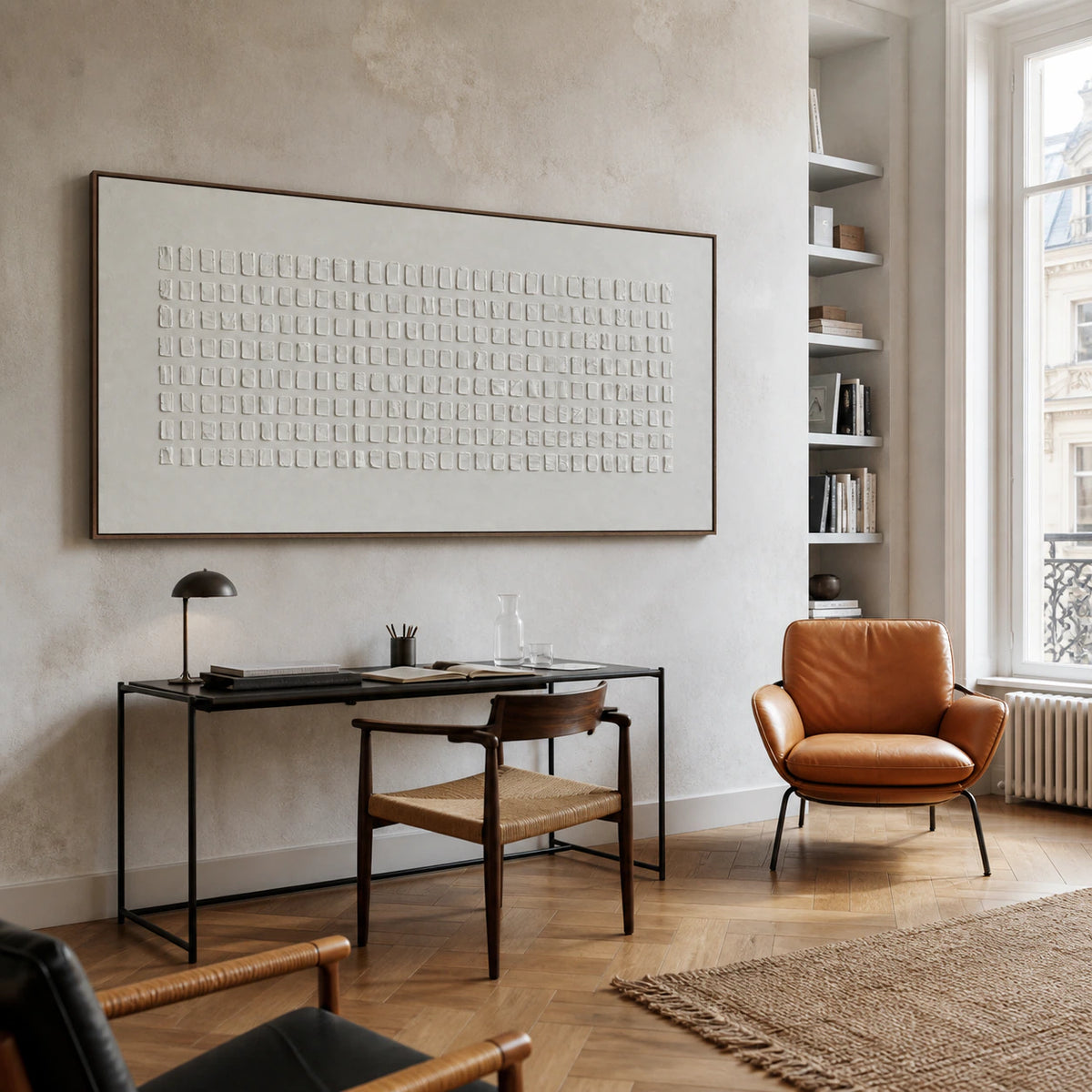 Airy home office with the white geometric relief artwork as the central wall feature.