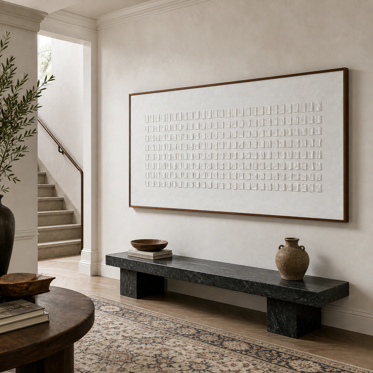 Gallery-scale foyer presenting the white geometric relief artwork at a monumental scale.