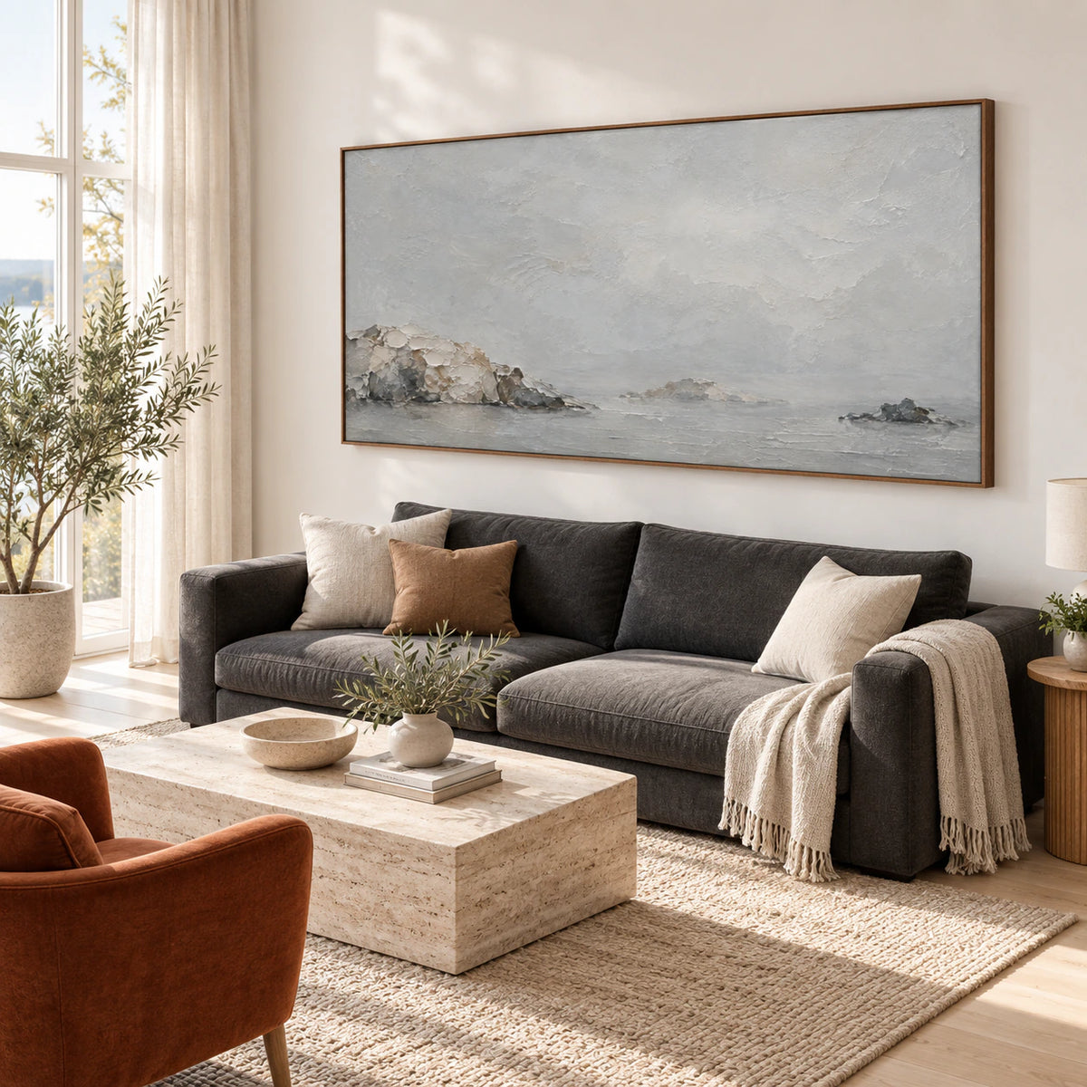 Quiet-Headland above a restrained sofa in a bright daylight living room.