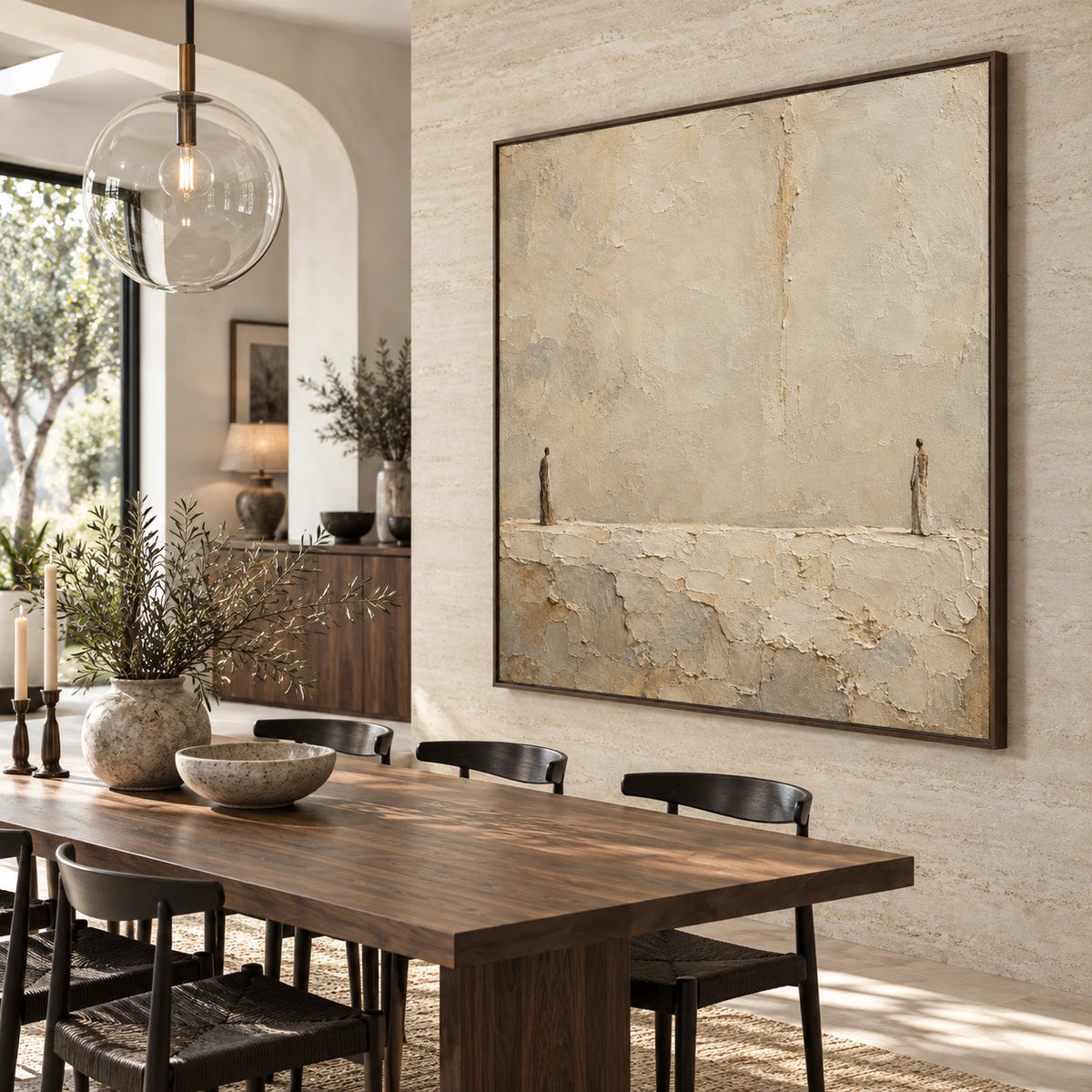 Ivory and sand textured painting with two small figures in a refined daylight dining room.