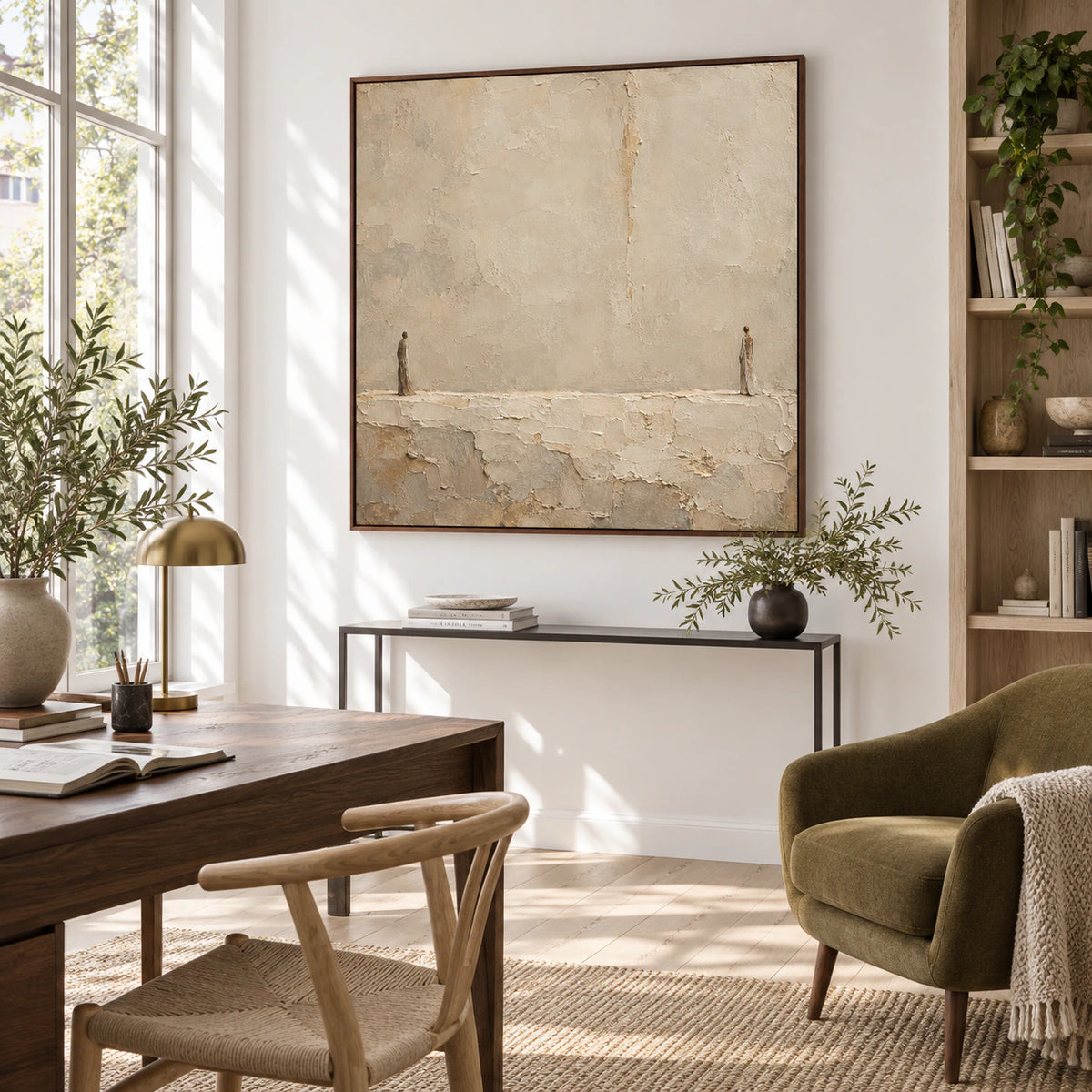 Large neutral textured artwork in an airy reading and home office space.