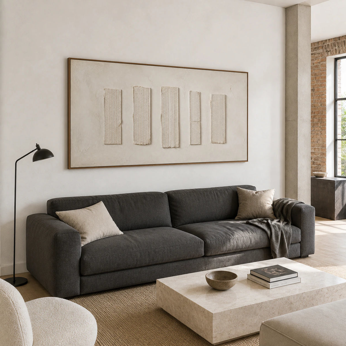 Quiet-Intervals as the focal point above a restrained sofa in a bright living room.