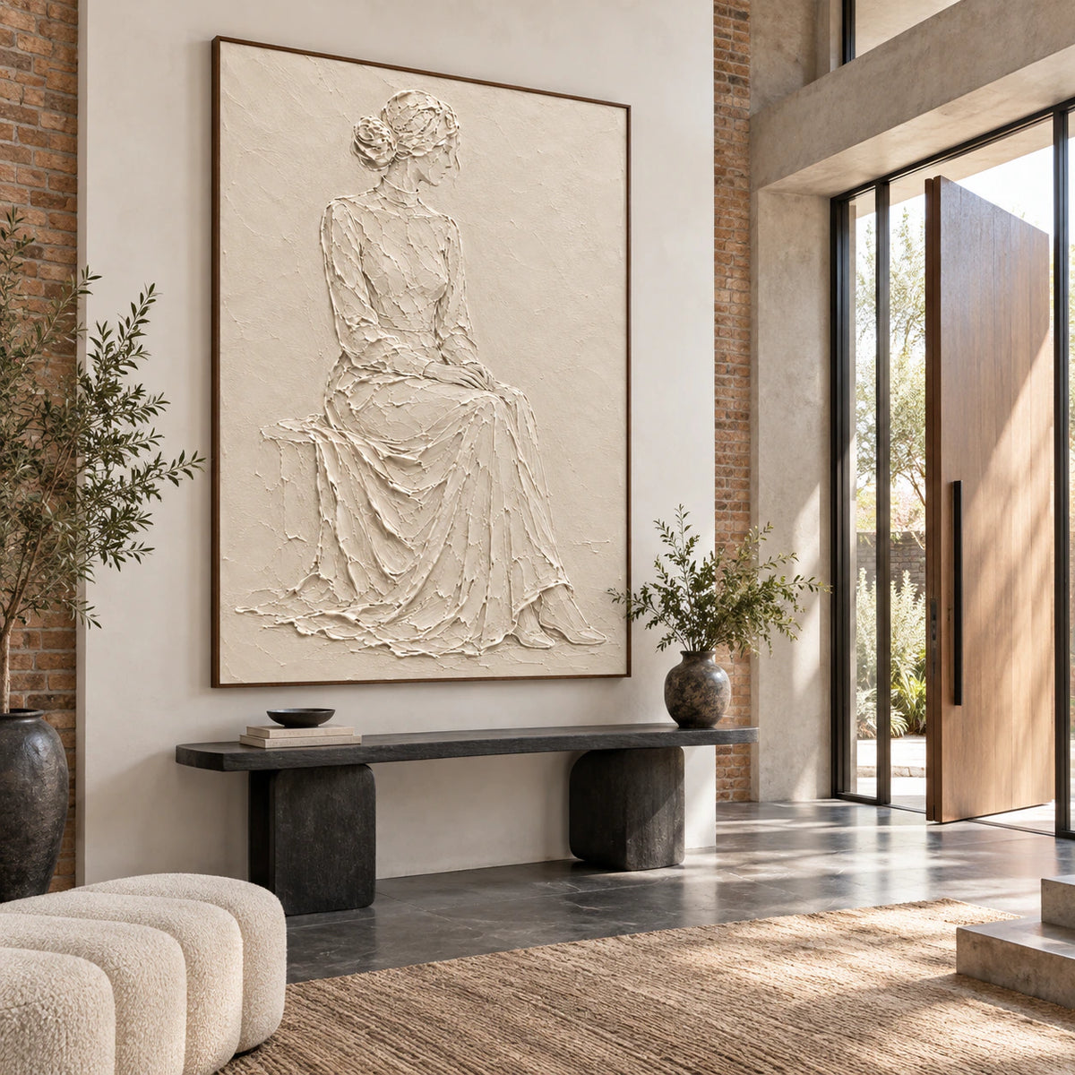Quiet-Muse large ivory figure relief artwork anchoring a gallery-scale foyer.