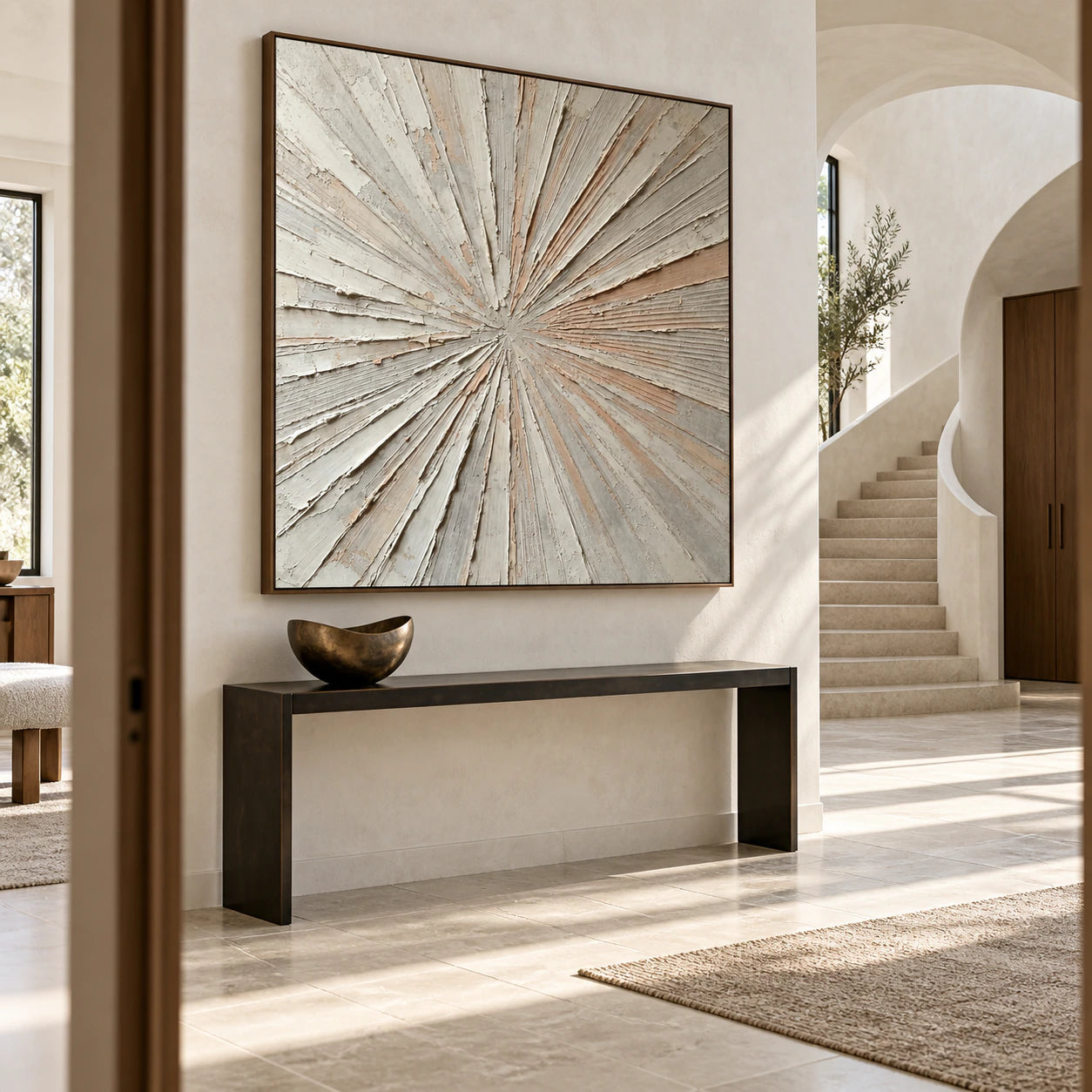 Large square radiating abstract painting in a gallery-scale foyer.