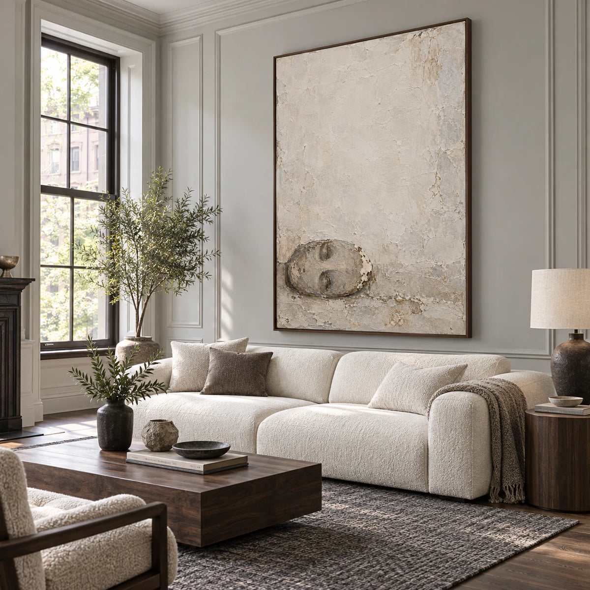Quiet-Relic textured vertical wall art above a sculptural sofa in a bright living room.