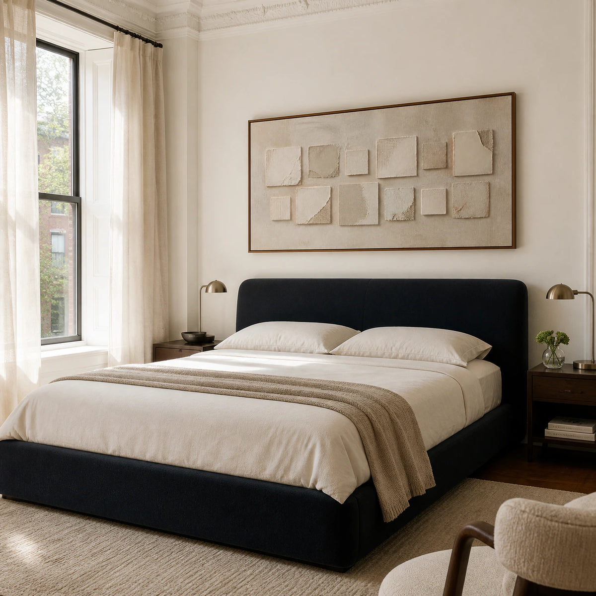 Quiet-Relief above a low upholstered bed in a calm, light-filled bedroom.
